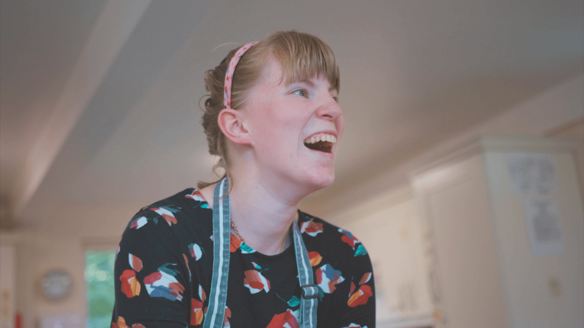Profile shot of a student laughing